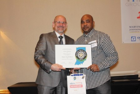 DMC employee awarding a Master Truck Driver